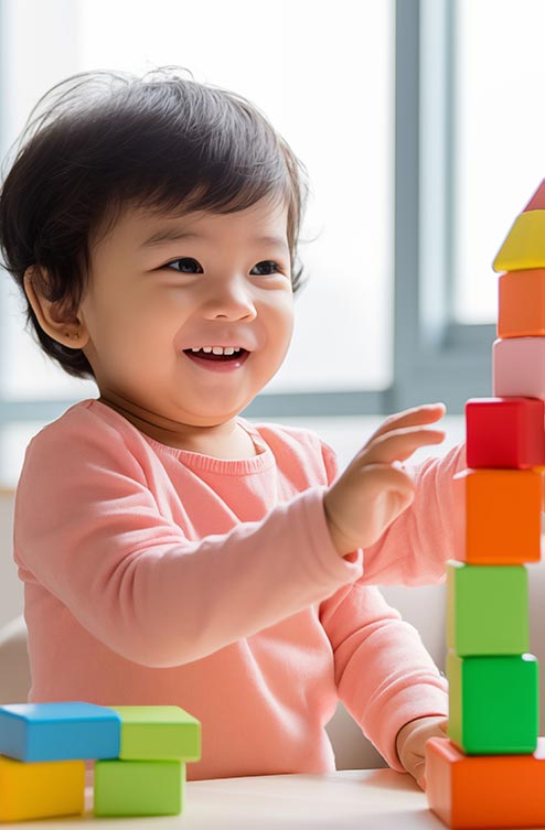 Smiling girl enjoying playtime at Krish Elite preschool