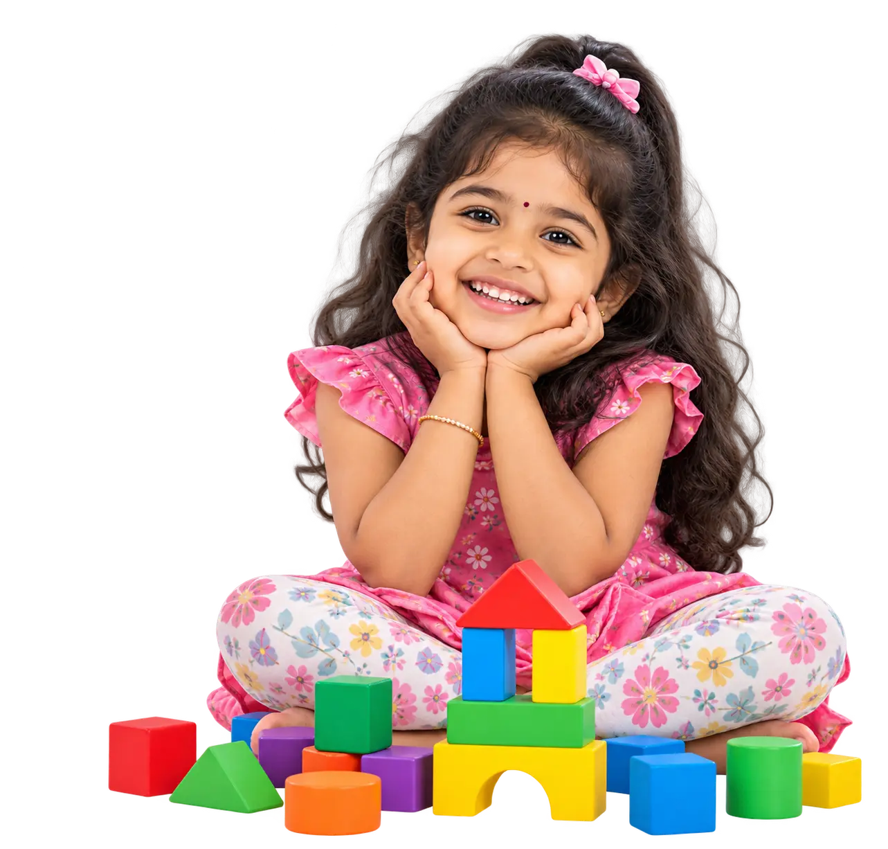 Girl smiling beside colourful building blocks at Krish Elite play school in ECIL