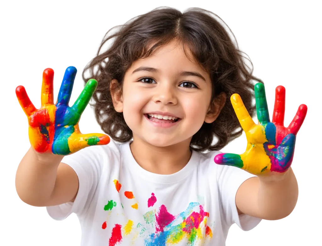 Smiling child showing paint-covered hands during an art activity at Krish Elite, a play school in ECIL